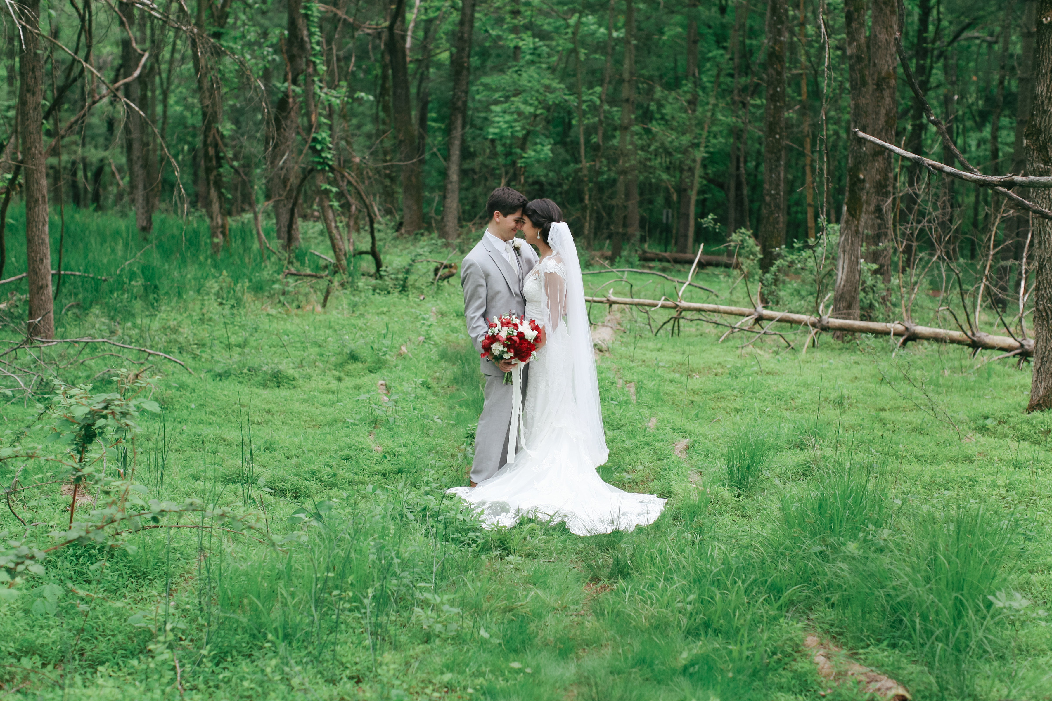 Hannah & Daniel: Manor Wedding, couple standing out in the grass among trees