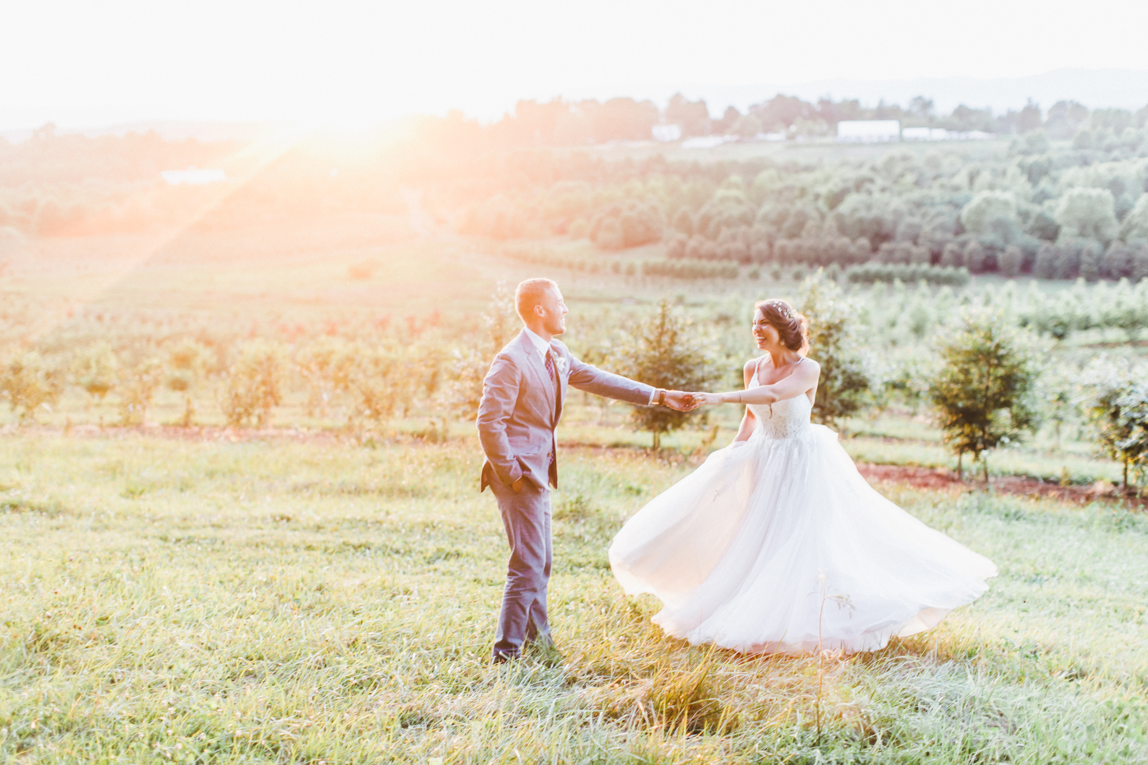 Alex and Stephanie: Tented Wedding, couple dancing together at sunset